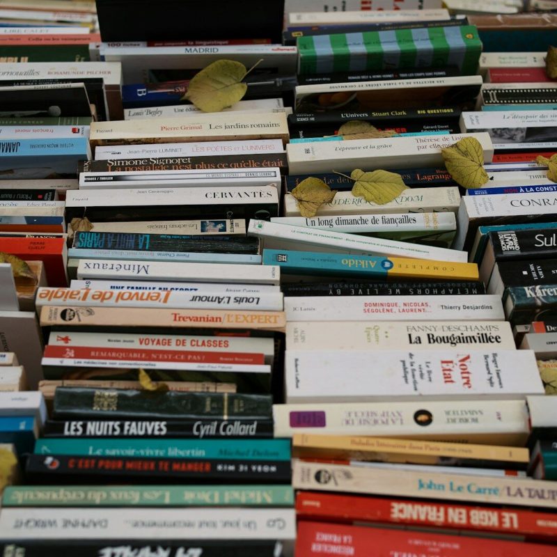 A pile of books sitting next to each other